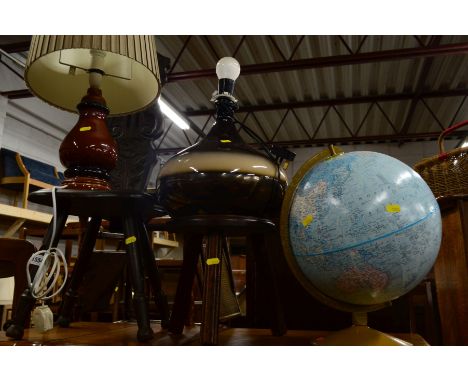 A CARVED OAK SPINNING CHAIR, milking stool, two glazed lamps and a terrestrial globe (5)