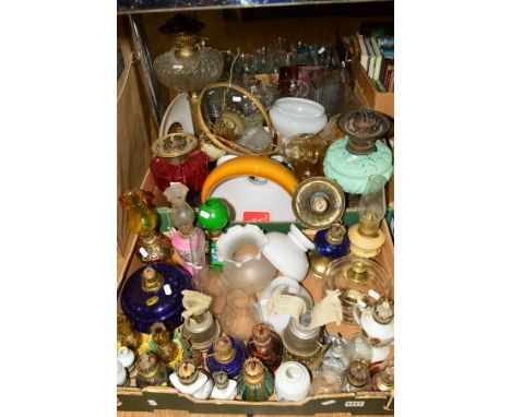 TWO BOXES OF OIL LAMPS, including cranberry glass reservoir, brass lamp having wrythen glass reservoir, various lamp shades, 