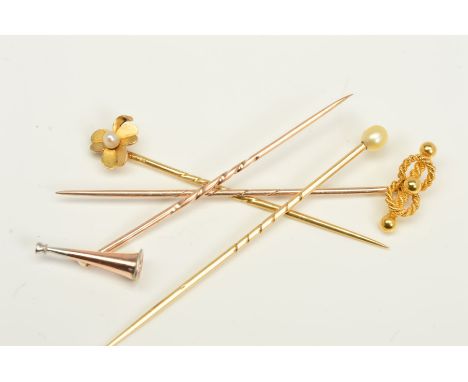FOUR STICKPINS, the first with a pearl terminal, the second with a three leaf clover terminal and central seed pearl, the thi