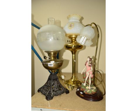 THREE TABLE LAMPS, including a brass twin burner oil lamp having milk glass shade measuring 63cm including shade, a brass and