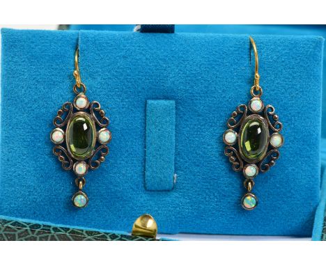 A PAIR OF PERIDOT AND OPAL DROP EARRINGS, each designed as a central oval peridot within a scrolling surround set with four c