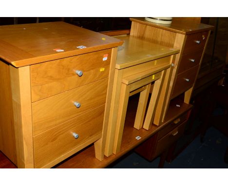 A PAIR OF LIGHT OAK FINISH THREE DRAWER BEDSIDE CHESTS and a beech nest of three tables (3)