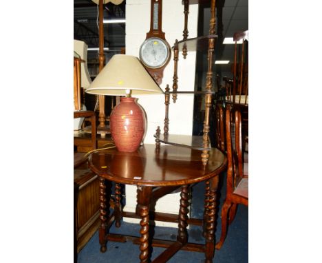 AN OAK BARLEY TWIST DROP LEAF TABLE, together with an oak aneroid barometer, corner whatnot and a decorative glazed table lam