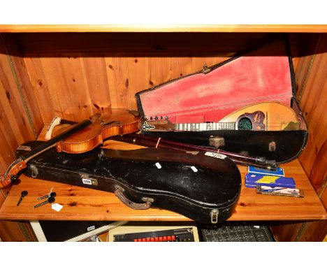 A CASED VIOLIN, label to the inside reads 'Antonius Stradiurarius Cremonetis, Faciebat AN017', with bow, a cased mandolin wit