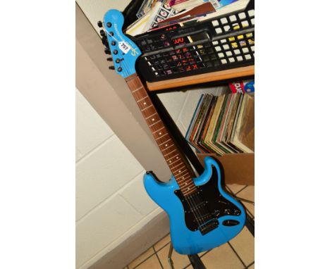 A SQUIRE STRATOCASTER FENDER GUITAR, marked Made in China, finished in a blue metallic, made in china