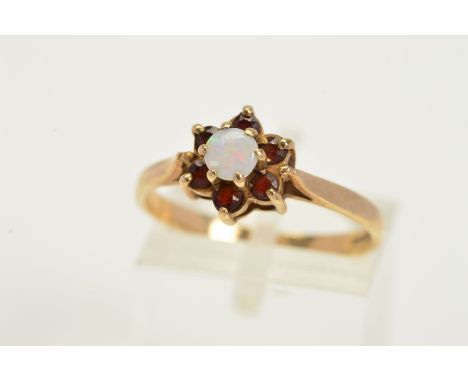 A 9CT GOLD OPAL AND GARNET RING, designed with a central opal and tiered circular cut garnet surround, 9ct hallmark for Birmi