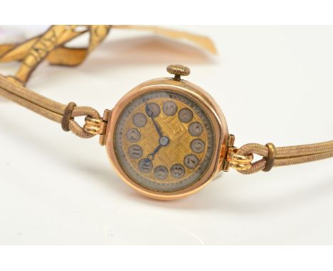 A 9CT GOLD CASED MECHANICAL WRISTWATCH, gold coloured Greek key design dial, manual wind movement with Rotary signed wheels, 
