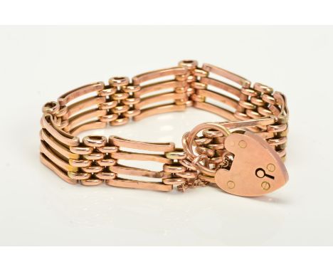 AN EARLY TO MID 20TH CENTURY ROSE GOLD FOUR STRAIGHT GATE BRACELET, approximate length 180mm, fitted to padlock and safety ch