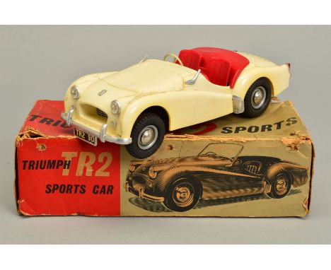 A BOXED VICTORY INDUSTRIES PLASTIC BATTERY OPERATED TRIUMPH TR2 SPORTS CAR, 1/18 scale in ivory with dark red interior, not t