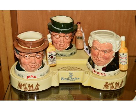 A ROYAL DOULTON STAND 'THE PICKWICK COLLECTION', with three advertising character jugs, 'Mr Pickwick', first of a series of l