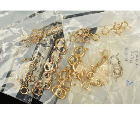 A SELECTION OF BOLT RING CLASPS, approximate diameters 5mm to 7mm, most with marks to indicate 9ct gold, approximate total we