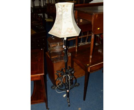A DECORATIVE WROUGHT IRON STANDARD LAMP