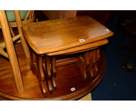 AN ERCOL GOLDEN DAWN ELM NEST OF THREE TABLES