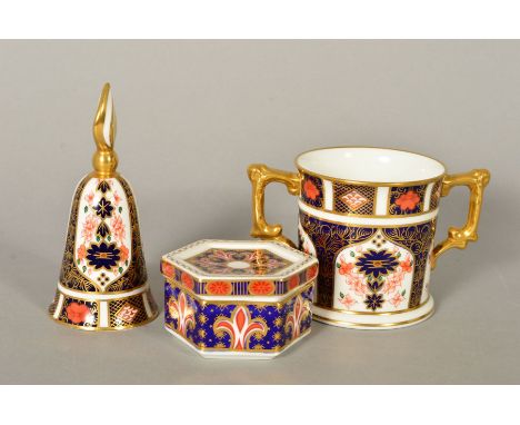 THREE PIECES ROYAL CROWN DERBY, to include '1128' pattern loving cup, height 8cm and bell shaped trinket, height 12cm and a A