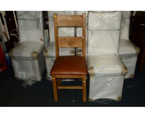 A SET OF SIX LIGHT OAK DINING CHAIRS with brown leather seats (all brand new and in original packaging, one unwrapped for sho