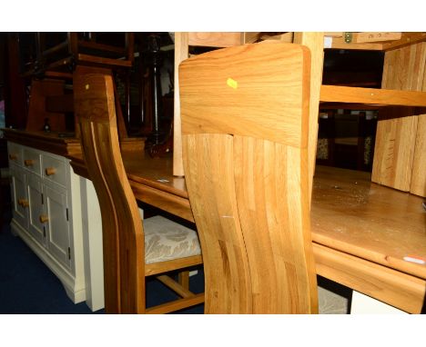 A REPRODUCTION LIGHT OAK TOPPED DINING TABLE on a cream painted base, width 150cm x depth 75cm x height 76cm, four shaped bac