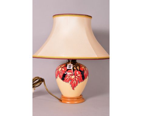 A MOORCROFT POTTERY TABLE LAMP BASE, with a shade, 'October Falling Leaves' pattern designed by Kerry Goodwin, approximate to