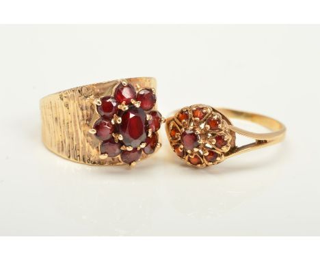 TWO GARNET RINGS, the first a 9ct gold ring designed as a garnet cluster to the wide tapered textured band, with 9ct hallmark