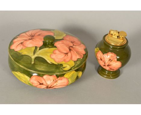 TWO PIECES OF MOORCROFT POTTERY, 'Hibiscus' pattern on green ground, to include a powder bowl and cover, diameter 17.5cm and 