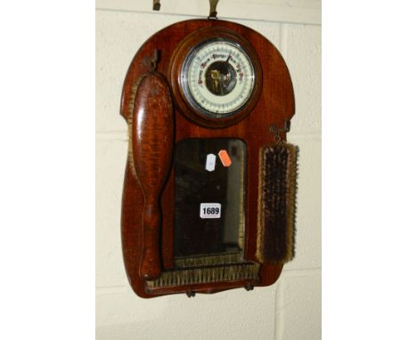AN EDWARDIAN OAK WALL MIRROR, with an aneroid barometer and three brushes