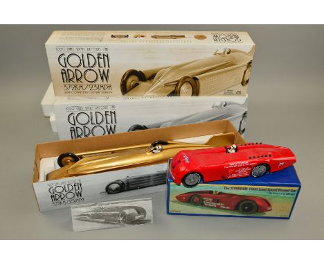 A BOXED SCHYLLING COLLECTOR SERIES CLOCKWORK GOLDEN ARROW 1929 LAND SPEED RECORD CAR, appears complete and in very lightly pl