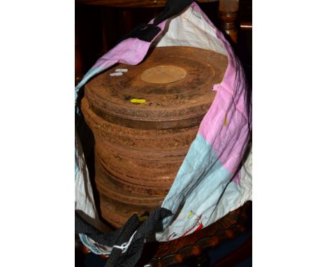 A BAG CONTAINING SEVEN METAL VINTAGE FILM REEL CASES (sd)