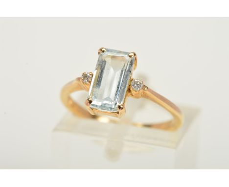 AN AQUAMARINE AND DIAMOND RING, designed with a central rectangular cut aquamarine within a four claw setting with two brilli