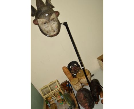 NATIVE ART INTEREST, Congo Salampusa mask, leather figure of a Hippopotamus, pair of drums, hardwood carved walking stick hav