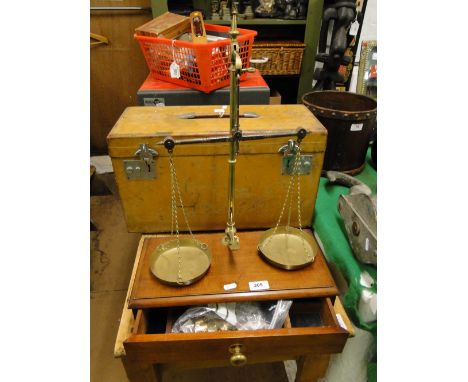 Set of brass balance scales on mahogany stand with tray & weights