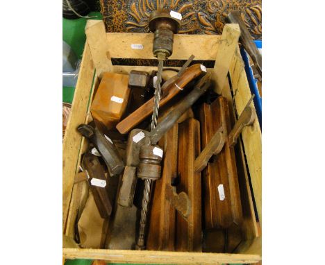 A box of woodworking tools including planes, saw & gauge