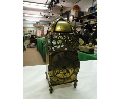 A brass lantern clock