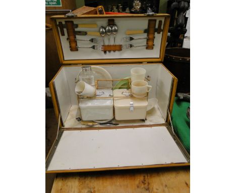 A vintage leather covered picnic hamper