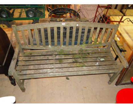 A hardwood slatted garden bench