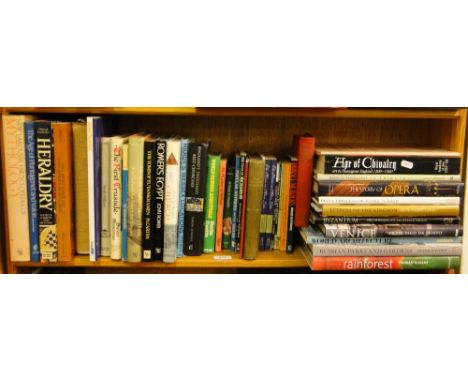 Shelf of hardback reference books, including Heraldry, Age of Chivalry etc