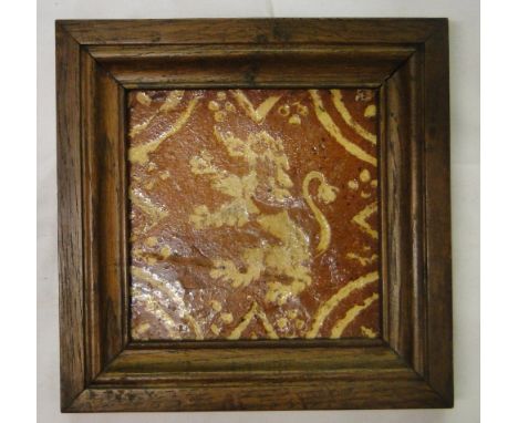 A European framed 16th century tile,with painted design of a lion, 7.25" across overall.