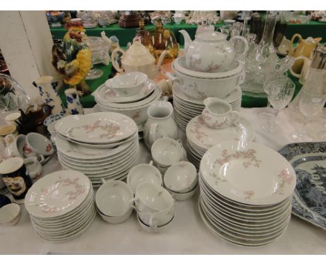 An Extensive Limoges dinner service including tureens, matching tea ware including a teapot