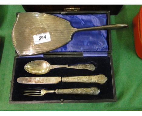 A Silver backed dressing table mirror & a cased 3 piece silver handled knife & spoon