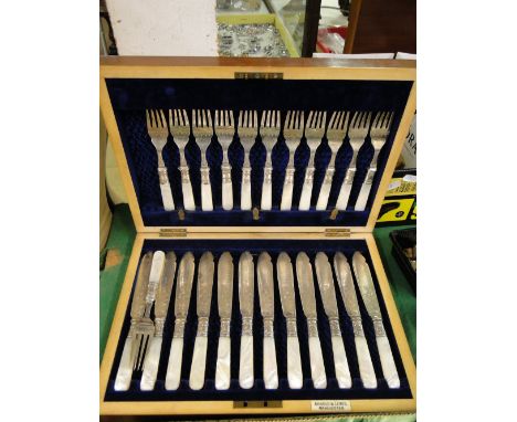 Edwardian mahogany cased canteen of fish cutlery for 12 people with mother of pearl handles, by Arnold & Lewis, Manchester
