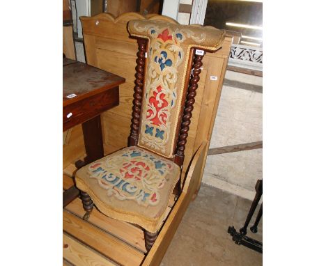 A Victorian mahogany prayer chair with barley twist columns & tapestry upholstery