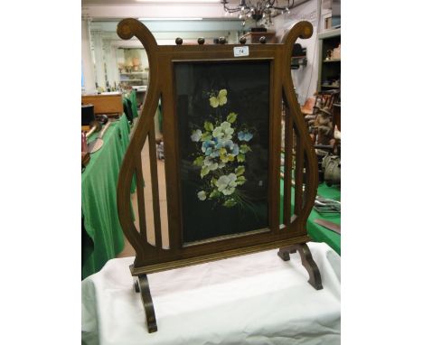 An Edwardian lyre shape inlaid mahogany firescreen,with painted panel of pansies, height 27.5".