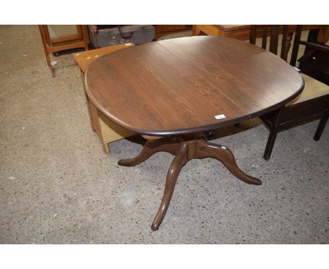 An Ercol pedestal dining table