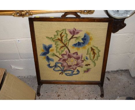A tapestry fire screen