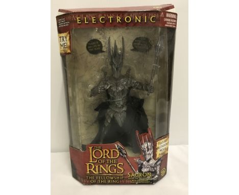 A boxed set  of The Lord Of The Rings, The Fellowship Of The Ring Electronic Sauron figure.  