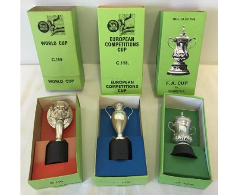 3 vintage boxed Subbuteo replica football cups. C.118 European Competitions Cup, C.119 World Cup and C.128 F.A. Cup. 