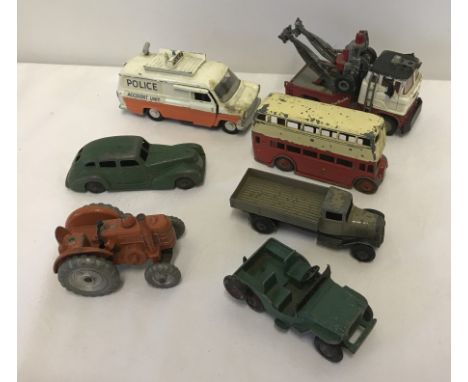 7 vintage Dinky diecast vehicles. To include Green Chrysler and Field Marshall Tractor. 