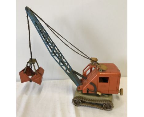 A vintage Gama tin plate and plastic battery operated grab crane.  