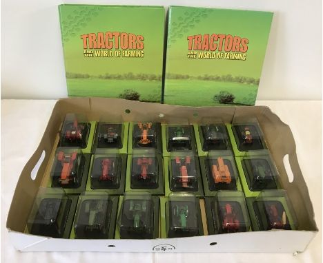 A box containing 18 boxed Hachette tractors scale 1:43. Together with 2 folders of "Tractors and the world of Farming" magazi