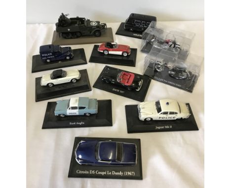 A collection of 11 diecast vehicles still secured on bases. To include US Army Gun Motor Carriage, 2 motorcycles and various 