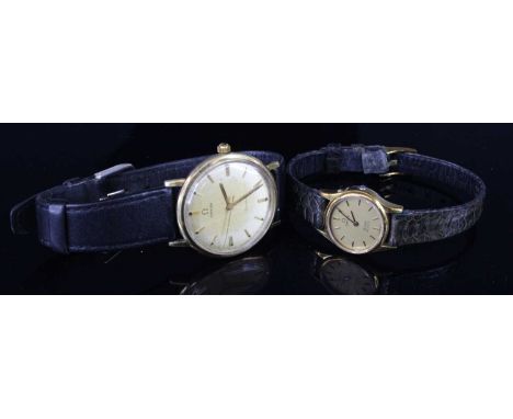 A vintage gent's Omega Geneve gold plated manual wind wristwatch, circa 1960, case dia.33mm (dial discoloured); together with