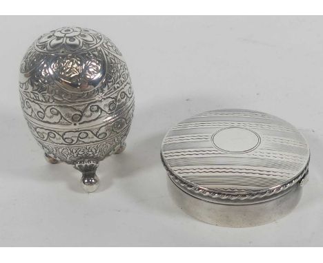 An Edwardian silver pill box of compressed circular form, having a gilt washed interior, TH Hazlewood &amp; Co., Birmingham 1